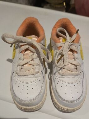 Kids Nike White Sneakers with Peach Trim and Yellow Accent